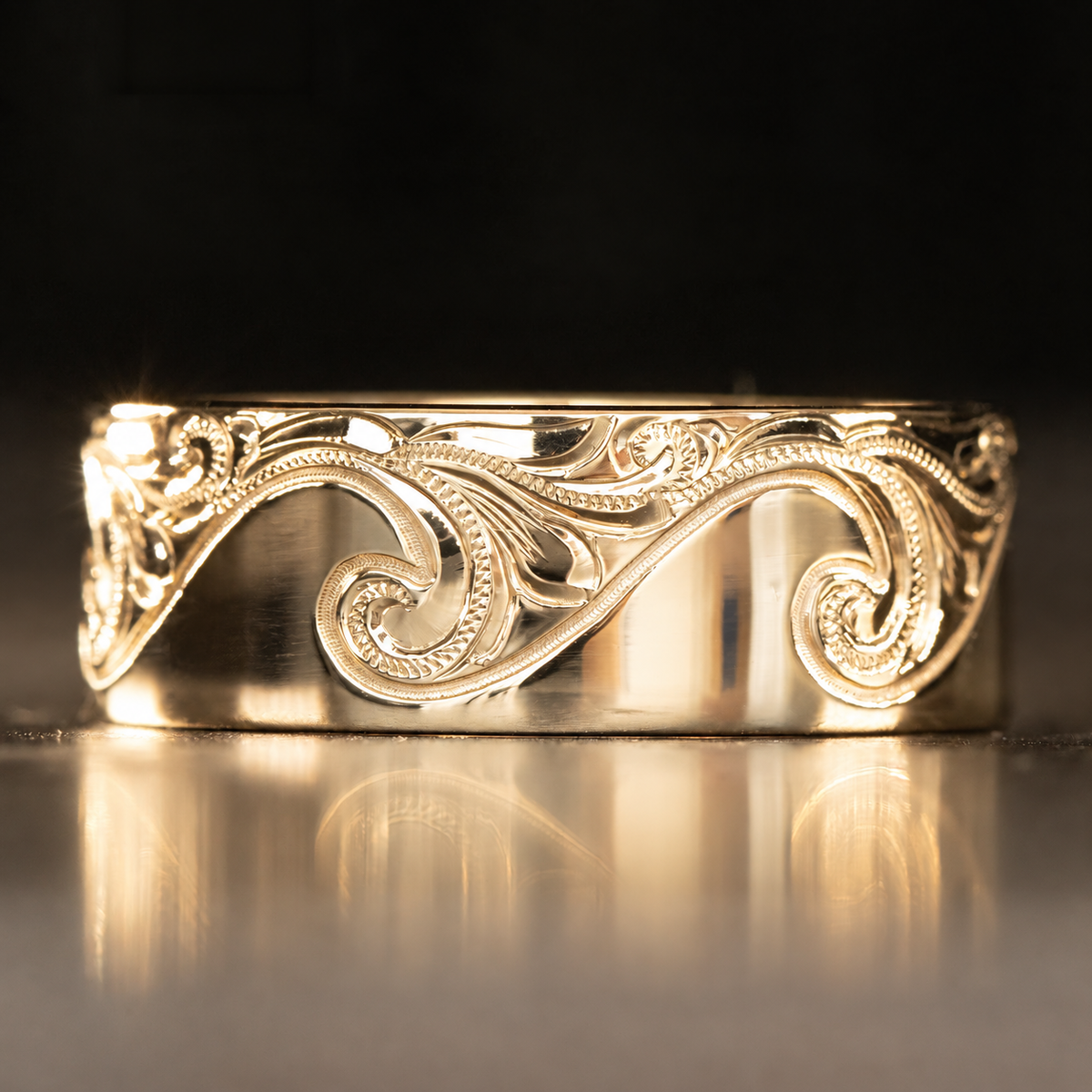 14K gold Catch the Wave 8mm ring hand engraved with a Hawaiian wave scroll design
