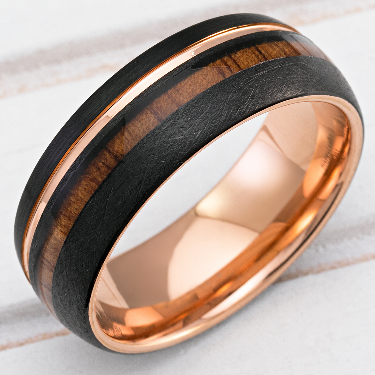 8mm black and rose gold tungsten ring with Hawaiian koa wood inlay, clean product image