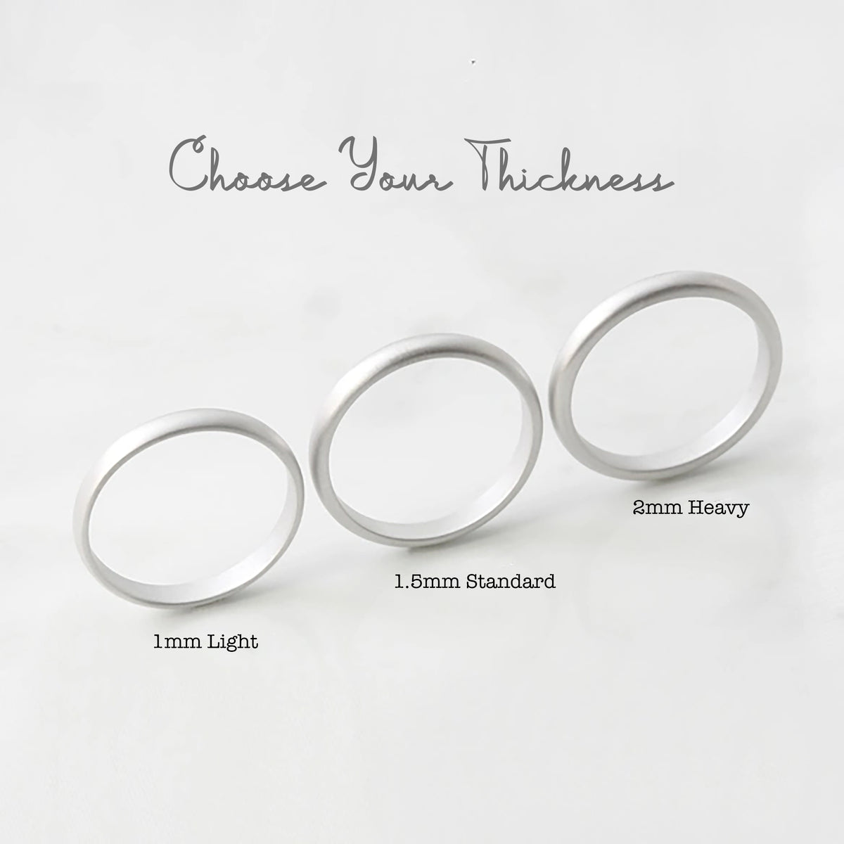 Ring thickness comparison chart showing 1mm light, 1.5mm standard and 2mm heavy bands