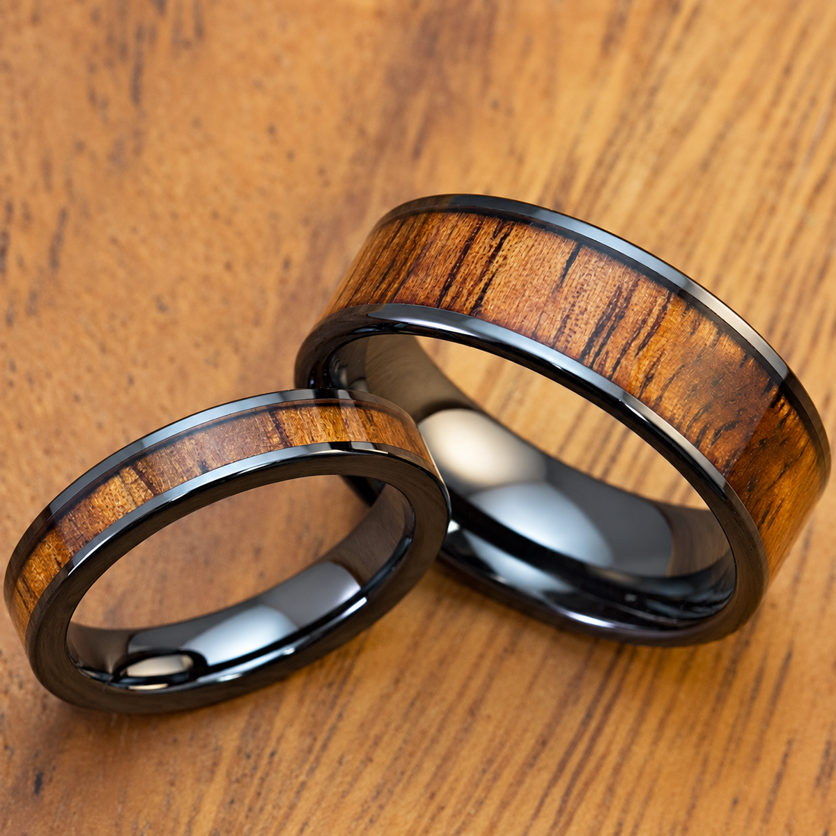 Black ceramic 4mm and 8mm ring set with Hawaiian koa wood inlay