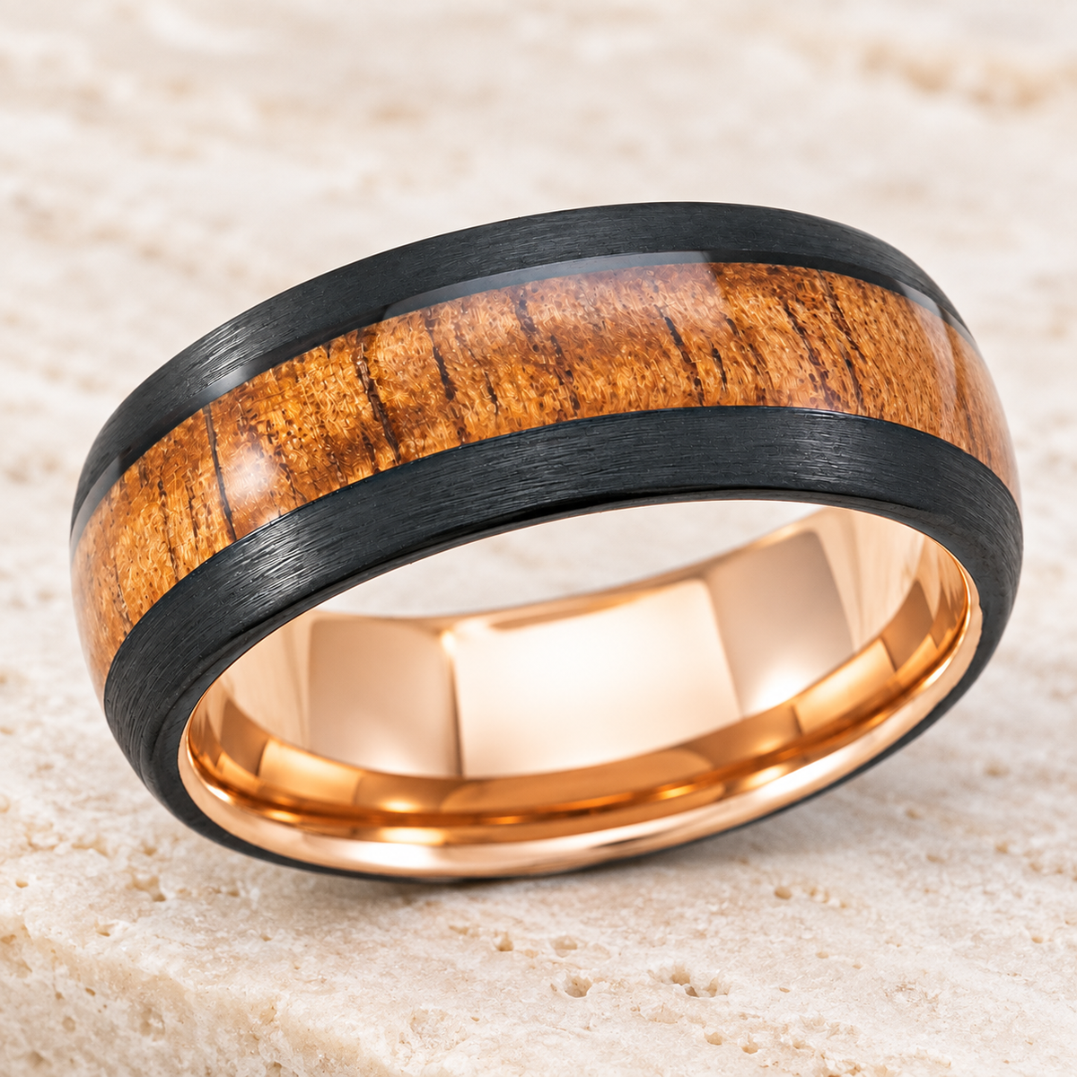 Black tungsten ring with Hawaiian koa wood inlay and rose gold interior, alternate angle