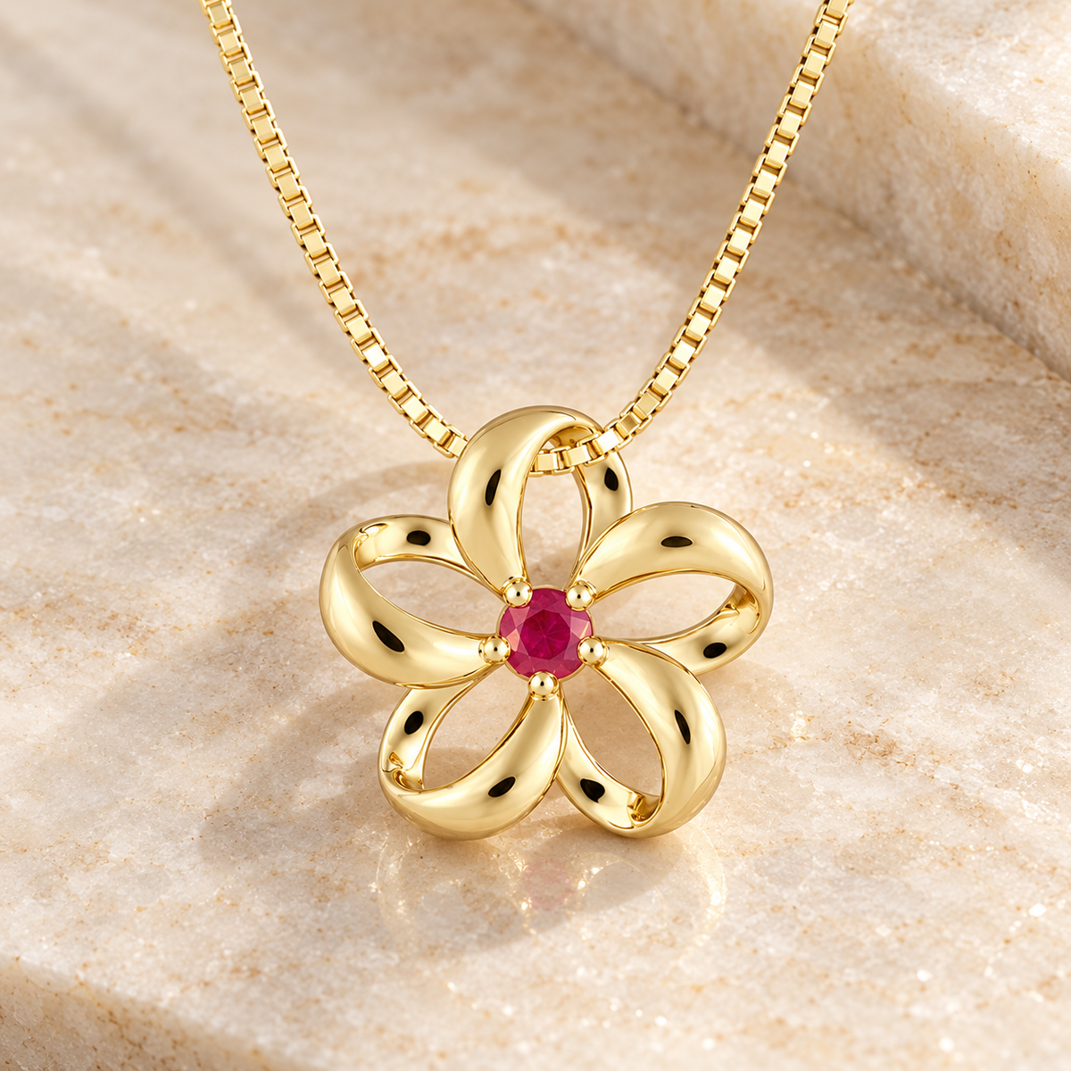 14K gold floating plumeria pendant with ruby at the center
