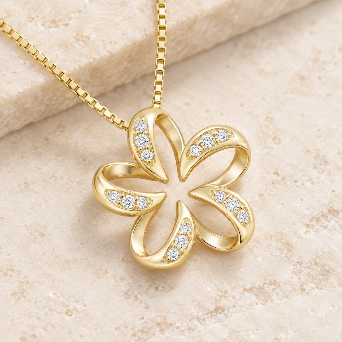 14K gold floating plumeria pendant with diamonds set in each petal