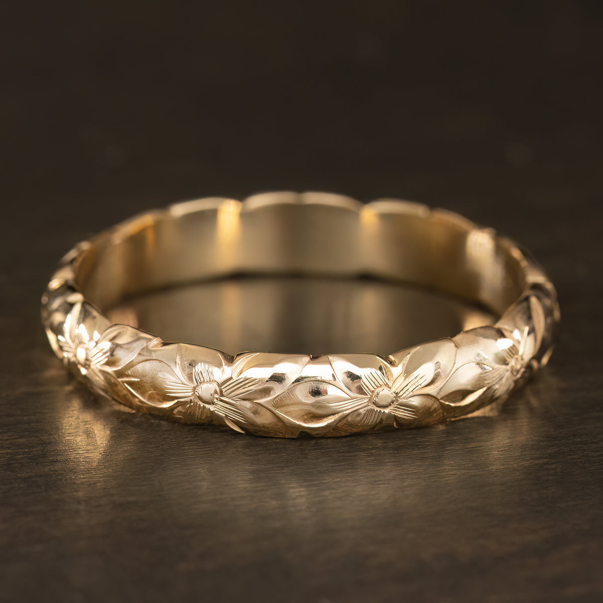4mm gold plumeria ring with scalloped edges, shown from the side