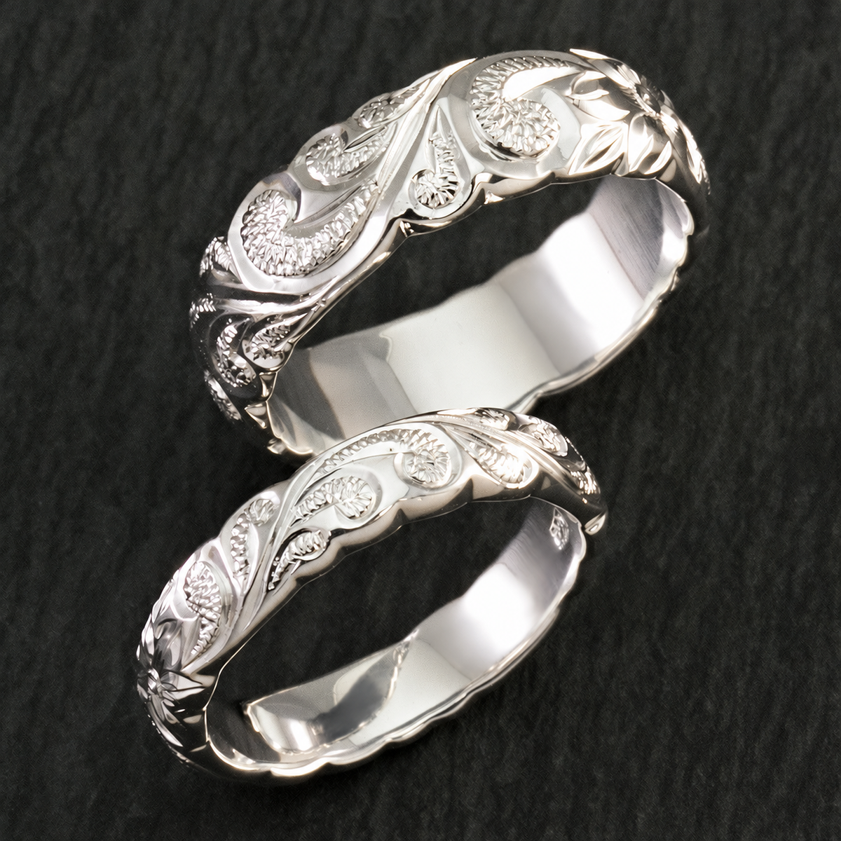 Pair of sterling silver Hawaiian scroll-engraved rings