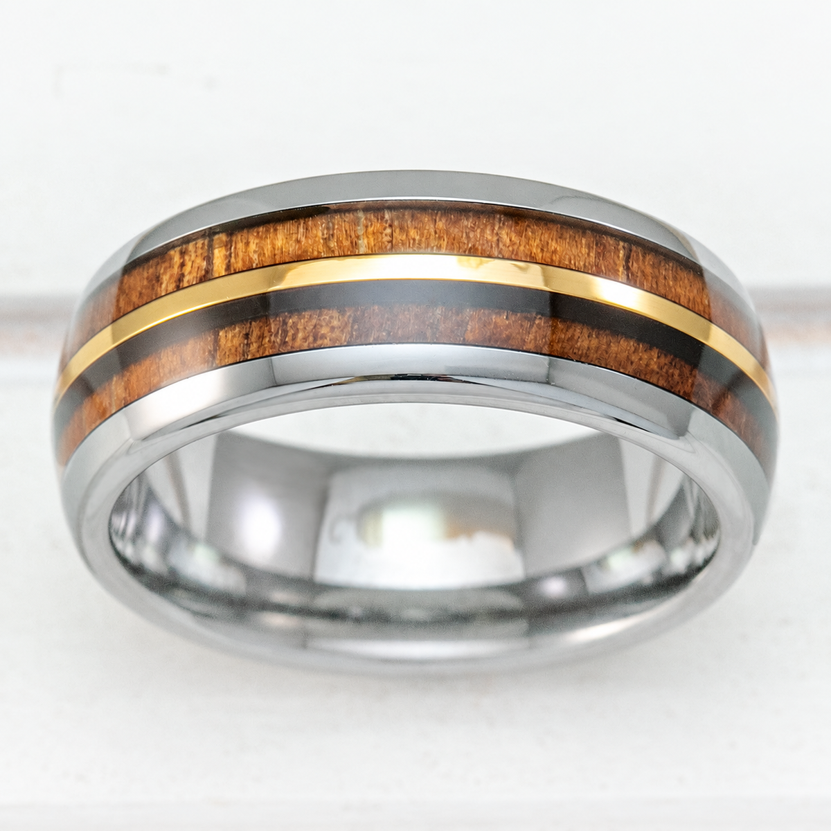 8mm tungsten ring with gold strip and Hawaiian koa wood duo-inlay, clean product image