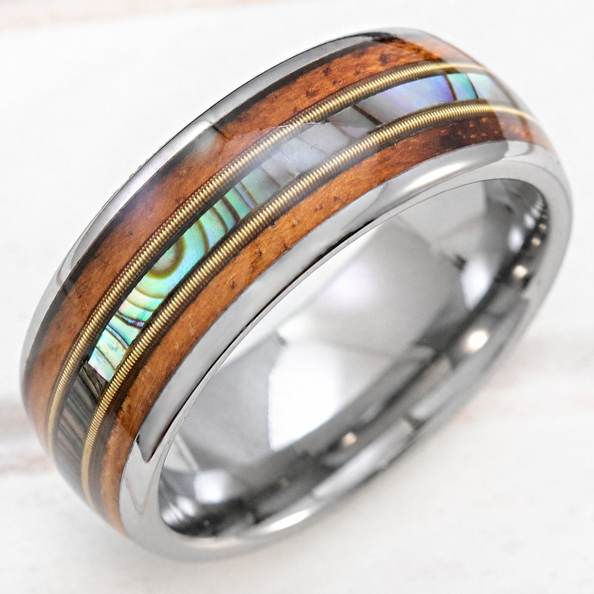 8mm tungsten ring with guitar string, abalone shell, and Hawaiian koa wood inlays, clean product image