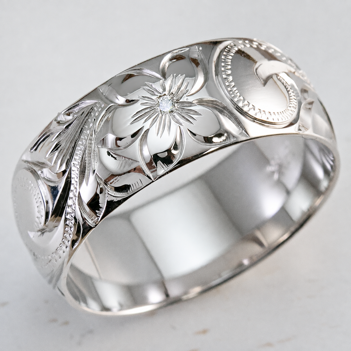 White-gold Hawaiian hand-engraved ring with center diamond