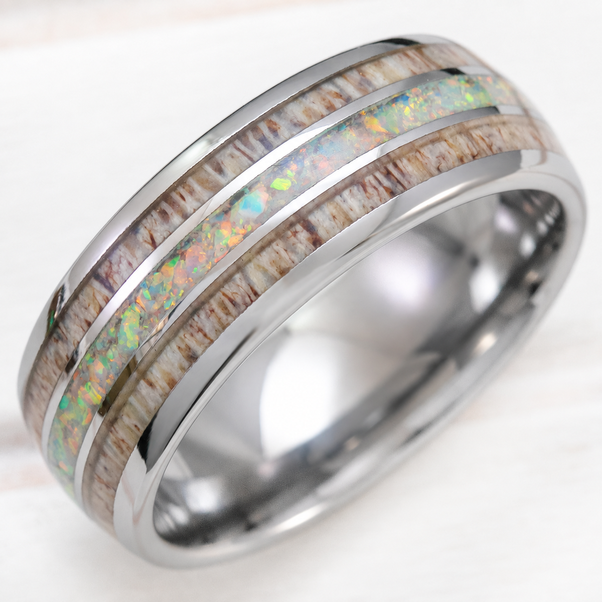 8mm tungsten ring with white opal and antler inlays, clean product image