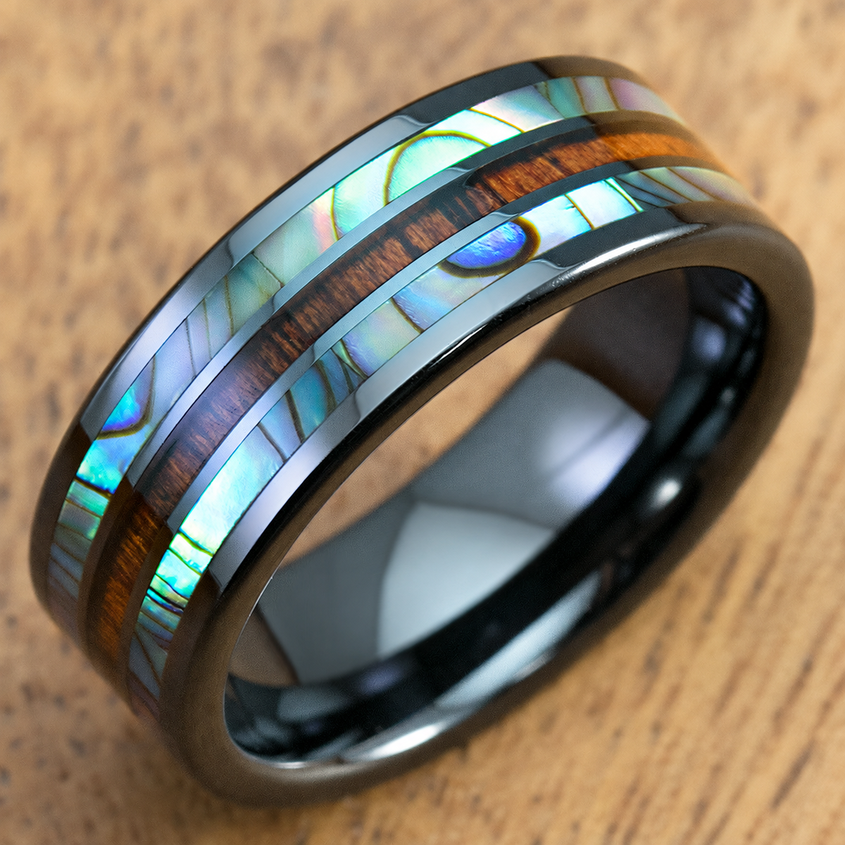 Black ceramic ring with abalone shell and Hawaiian koa wood