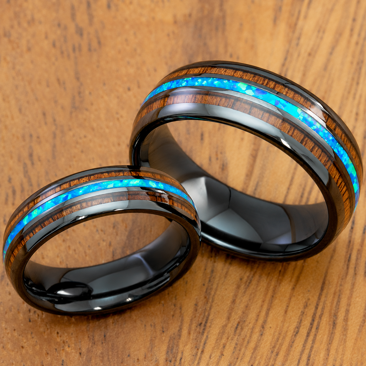 Black ceramic ring set with blue opal and Hawaiian koa wood tri inlays