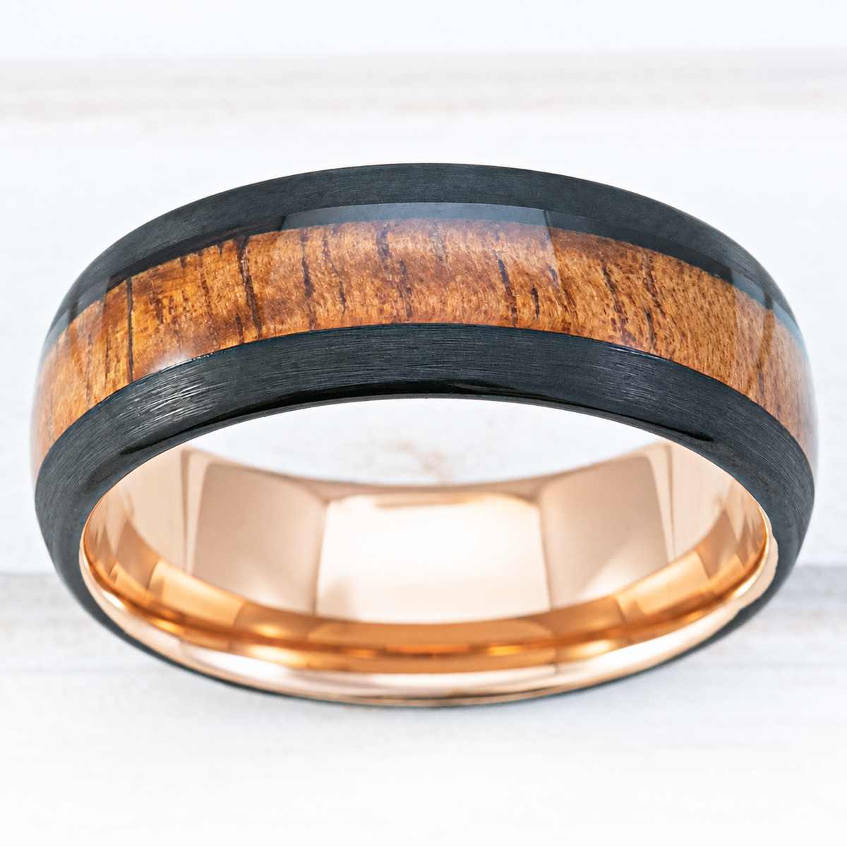 Black and rose gold tungsten ring with Hawaiian koa wood inlay