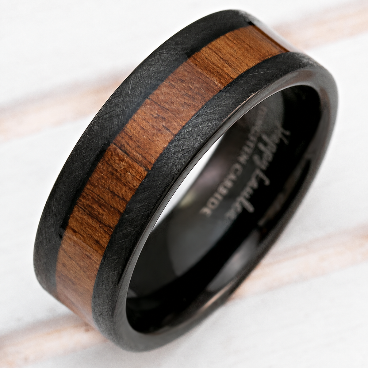 Black tungsten crossed brushed ring with Hawaiian koa wood inlay