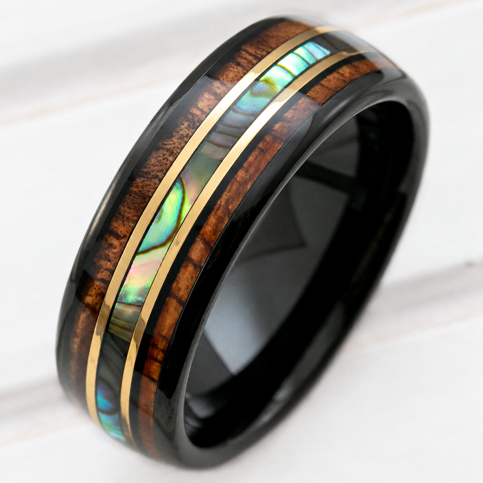 Black tungsten ring with Hawaiian koa wood, abalone shell, and gold strip inlay