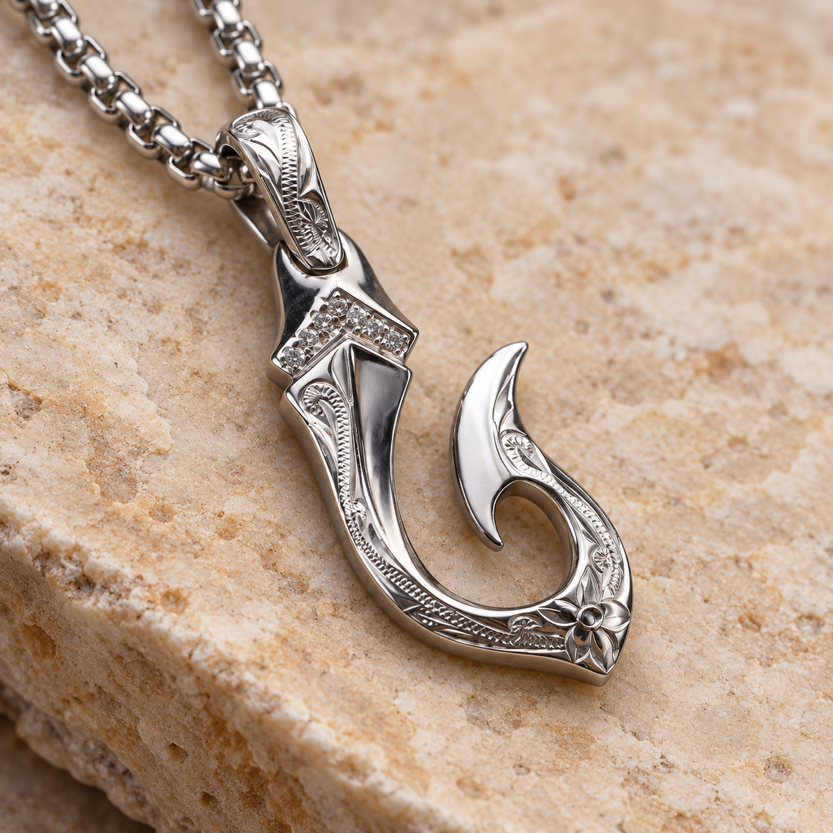 Hand engraved sterling silver Makau hook pendant, alternate angle