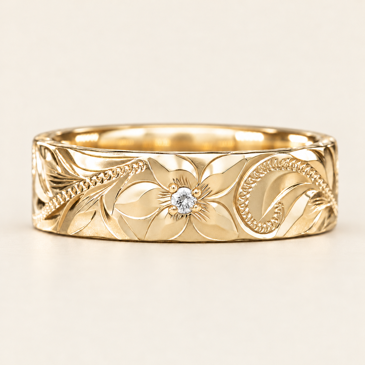 Yellow gold heavy style Hawaiian heritage ring with a flower-center diamond, front view on ivory