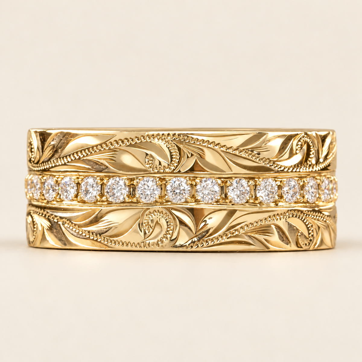 Yellow gold Palena ole infinity diamond ring with Hawaiian heritage engraving, front view on ivory