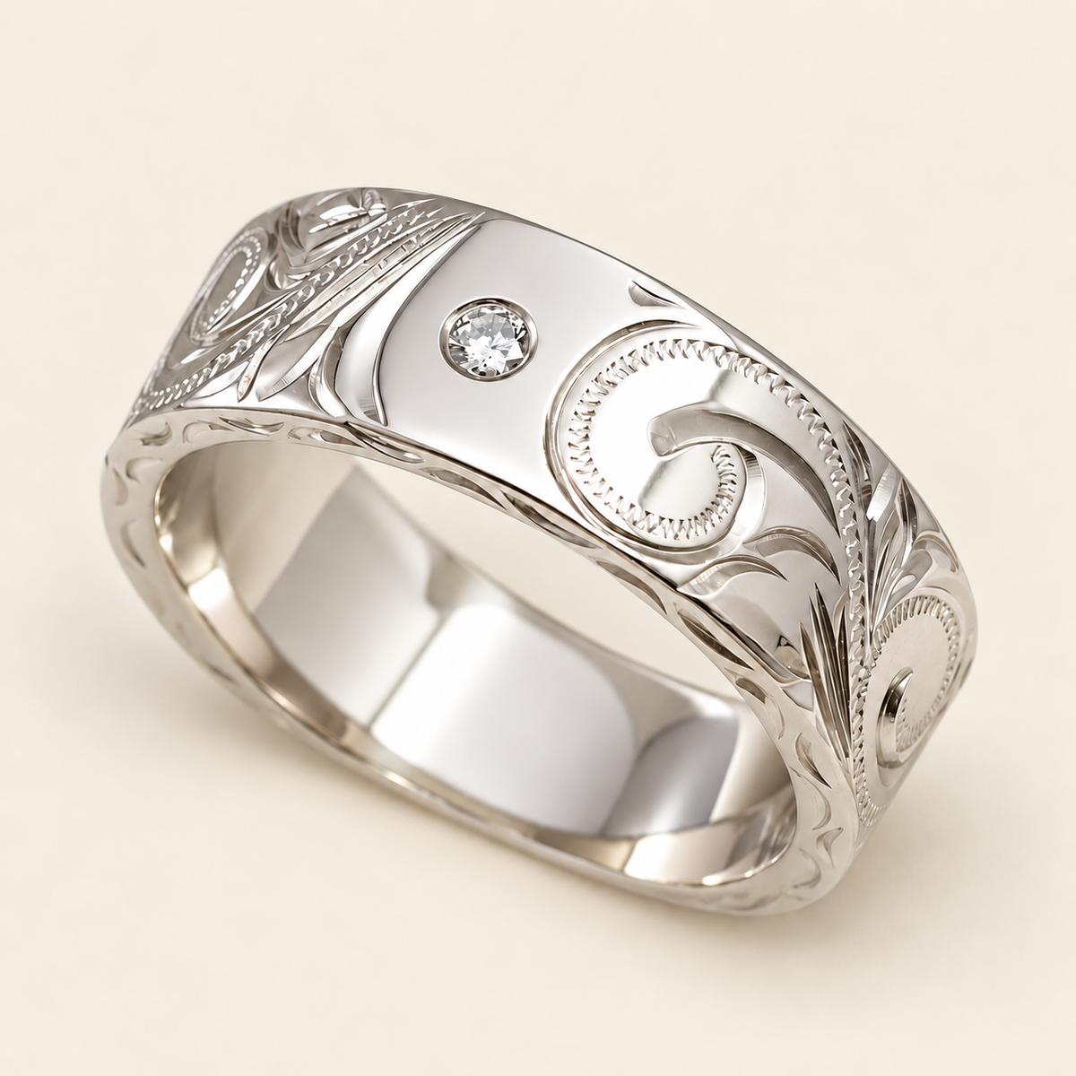 White gold heritage diamond ring, opposite angled view showing the smooth interior and engraved edges on ivory