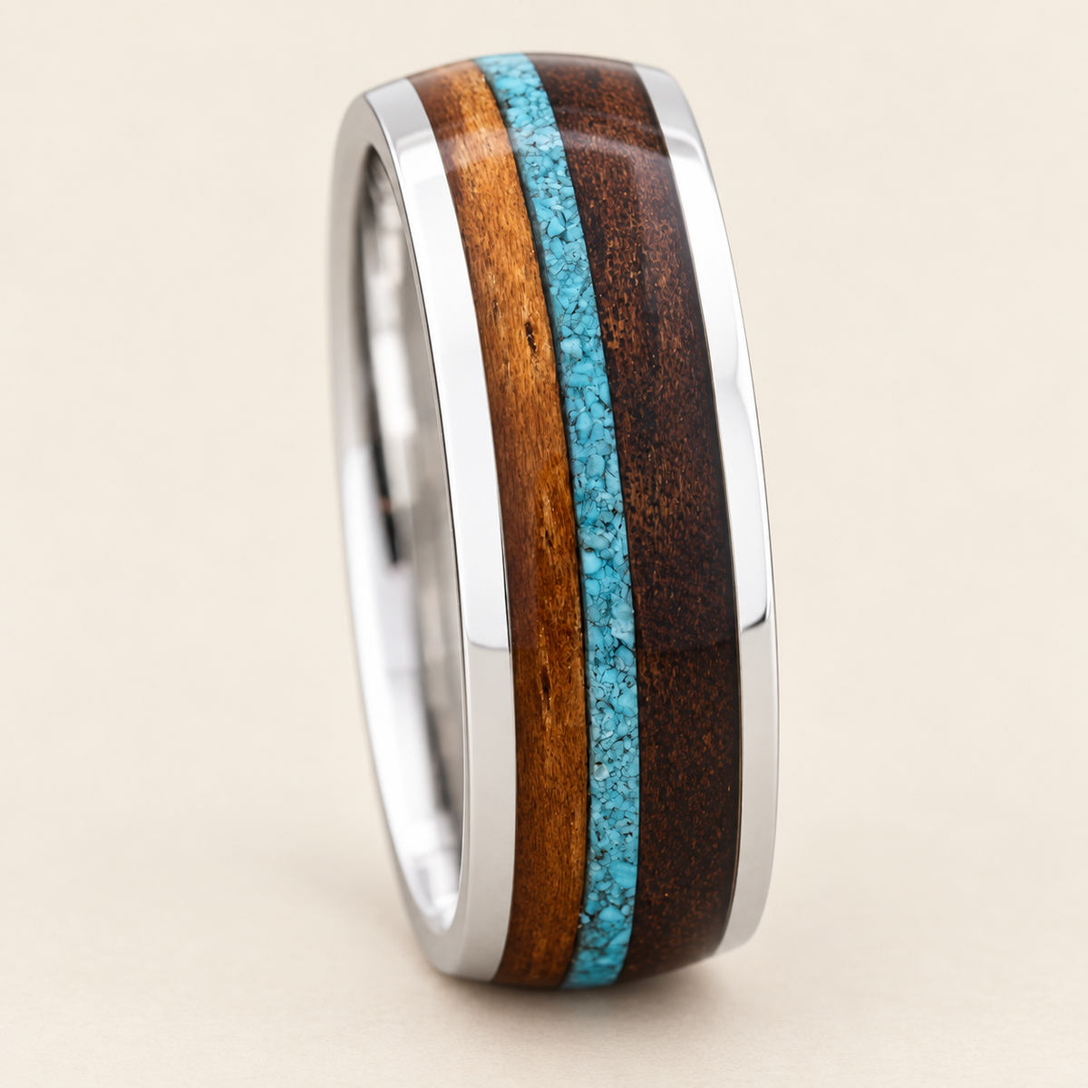 White gold 8mm ring with turquoise and Hawaiian koa wood inlays, upright front view on ivory