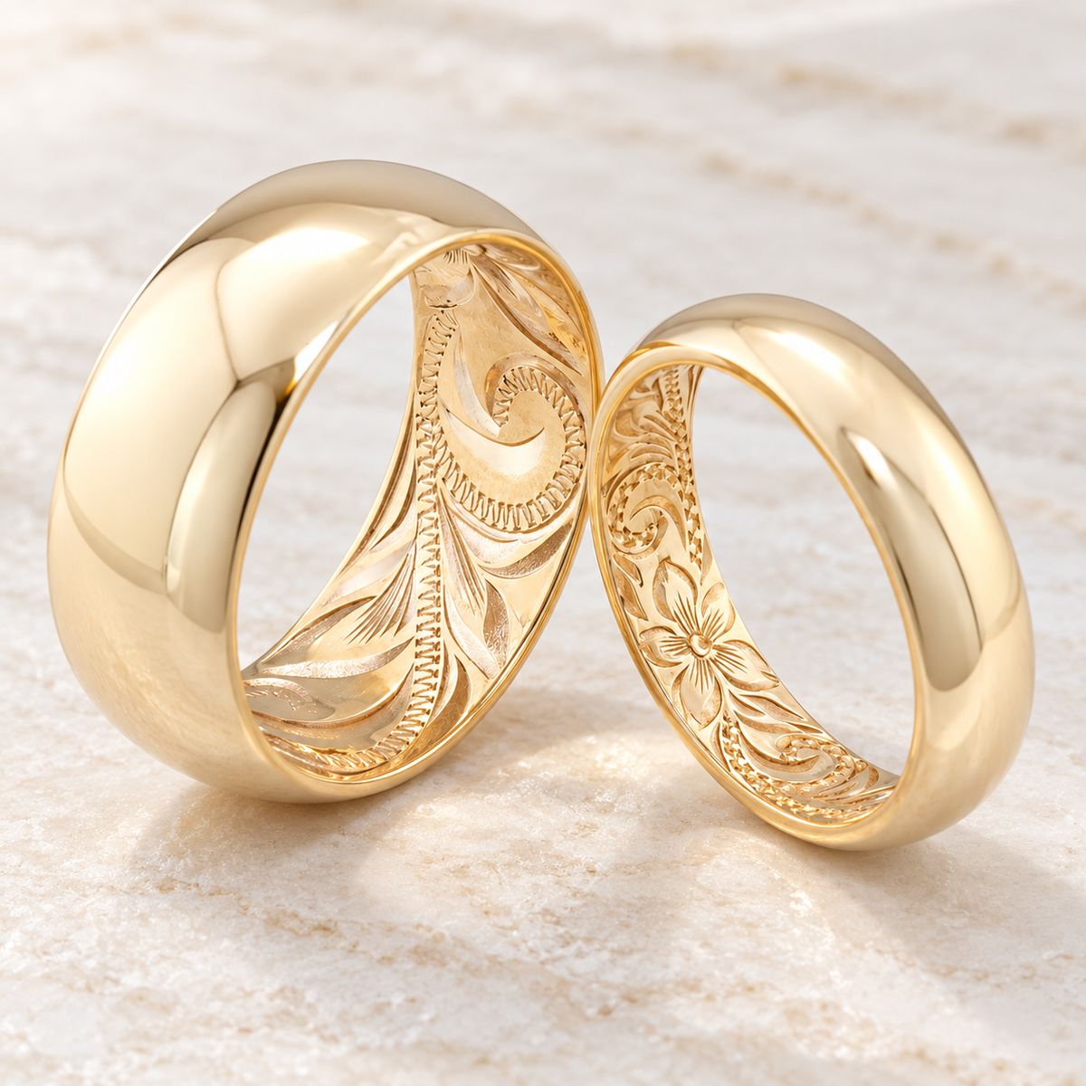 Two 14K yellow gold rings with Hawaiian engraving on the inside