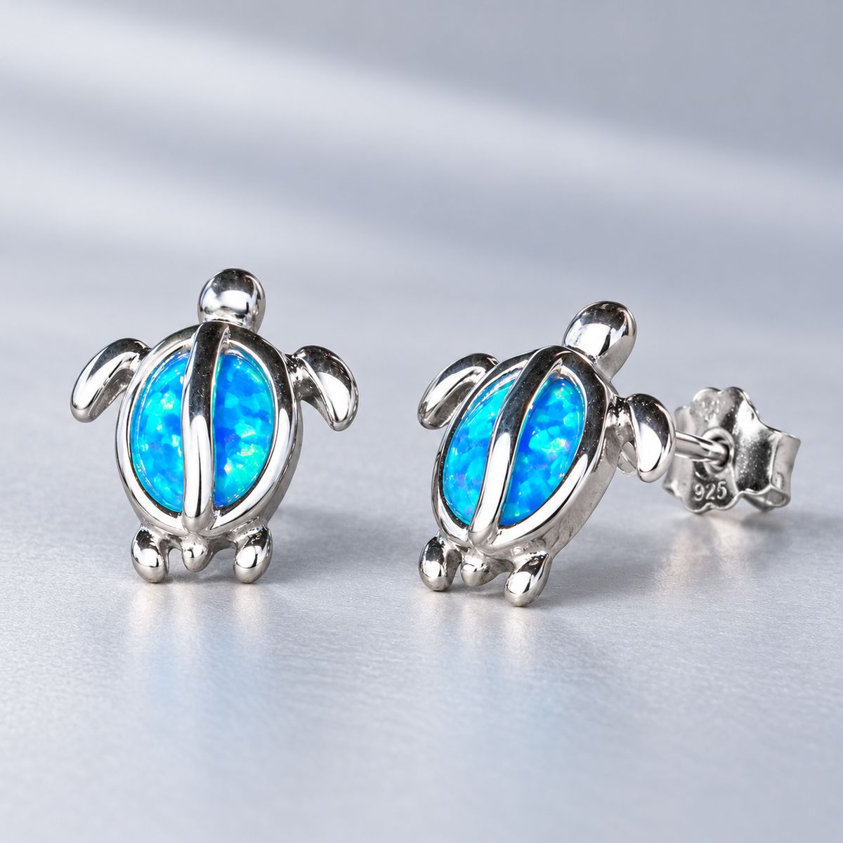 Sterling silver Hawaiian honu blue opal stud earrings, alternate angle