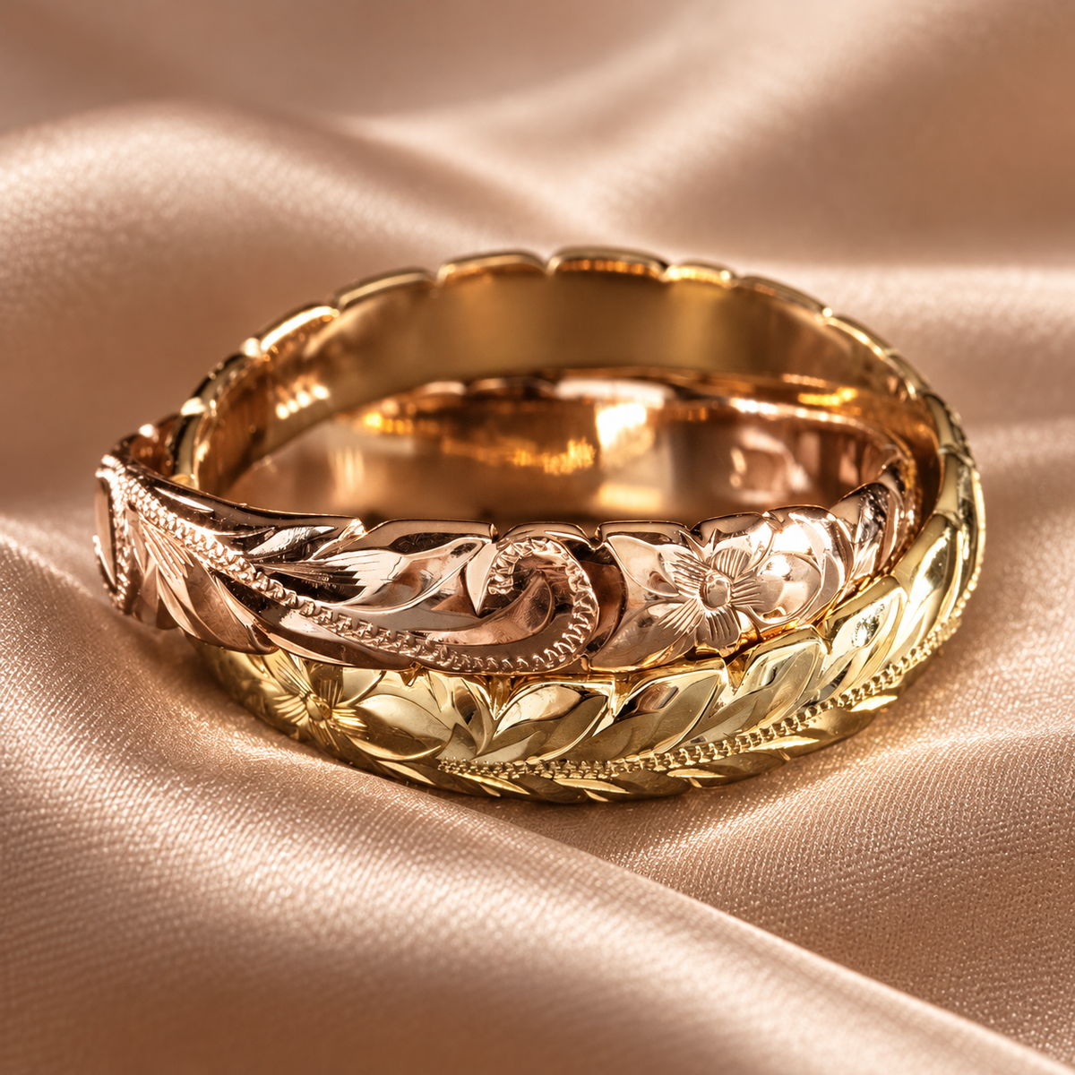 Yellow gold and rose gold Hawaiian Love Ring with Heritage plumeria and Maile leaf engraving on champagne silk