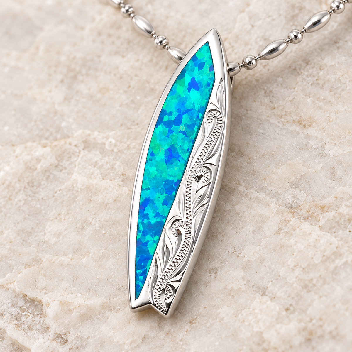 Sterling silver surfboard pendant with blue opal inlay, alternate angle