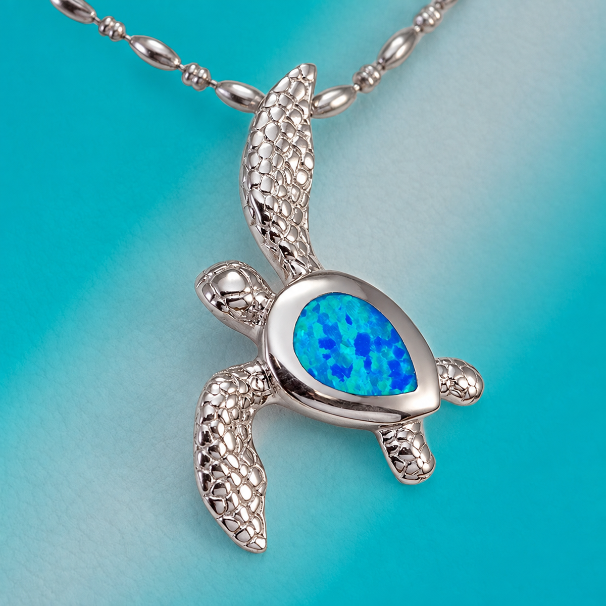 Sterling silver honu sea turtle pendant with blue opal