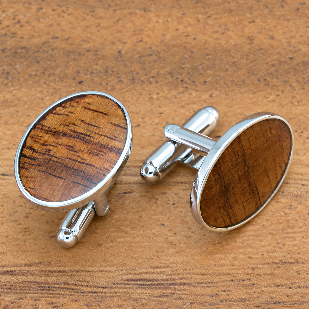 Silver coated brass oval cuff links with Hawaiian koa wood
