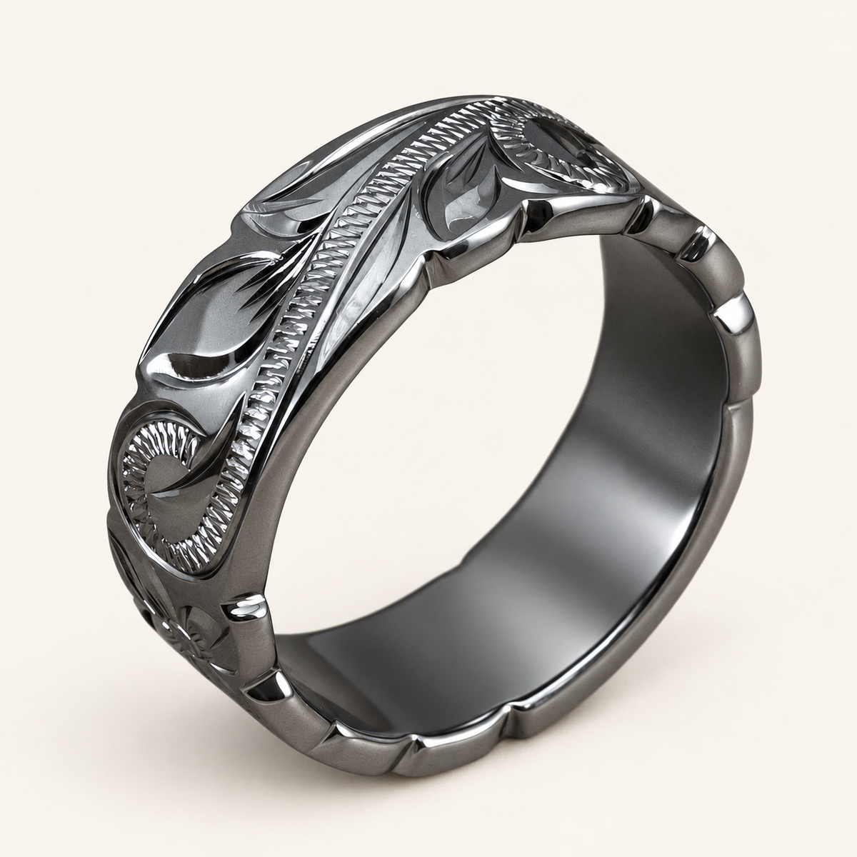 Black rhodium sterling silver 8mm ring with Hawaiian Old English scroll and leaf engraving and wave edges, upright view on ivory.