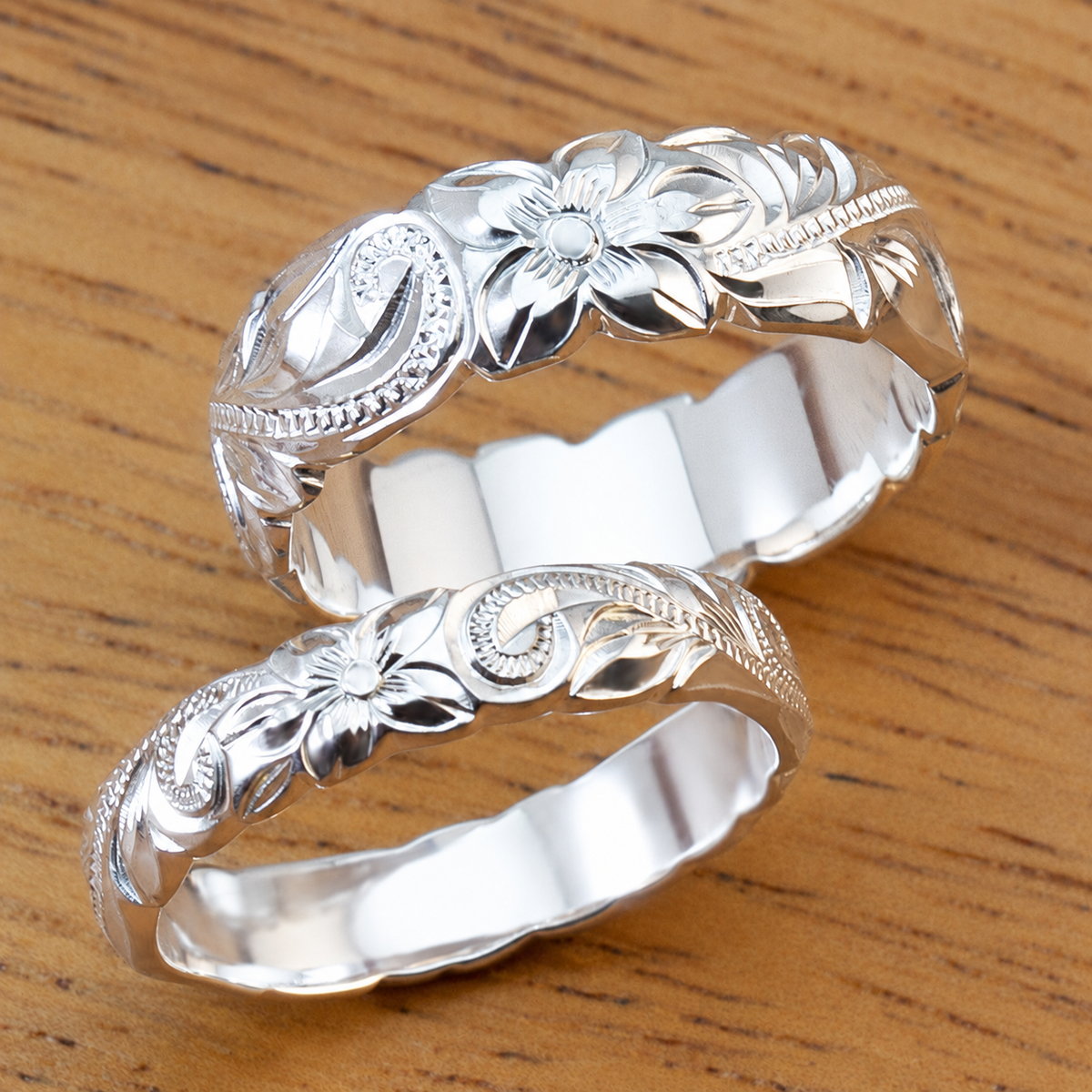 Pair of sterling silver Hawaiian hand-engraved rings