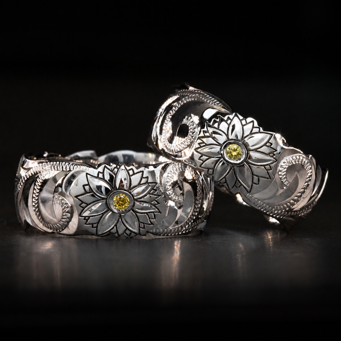 Hawaiian sunflower and Old English engraved gold rings with yellow center stones