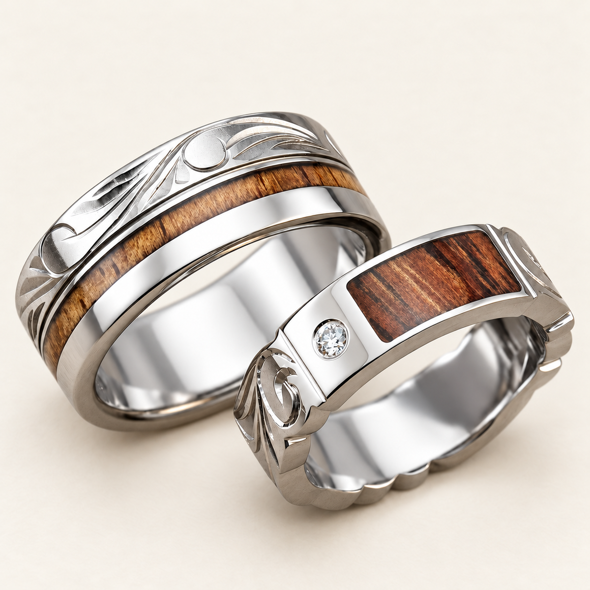 Titanium Hawaiian heritage ring set with koa wood inlays and a diamond on the narrow ring, front pair on ivory