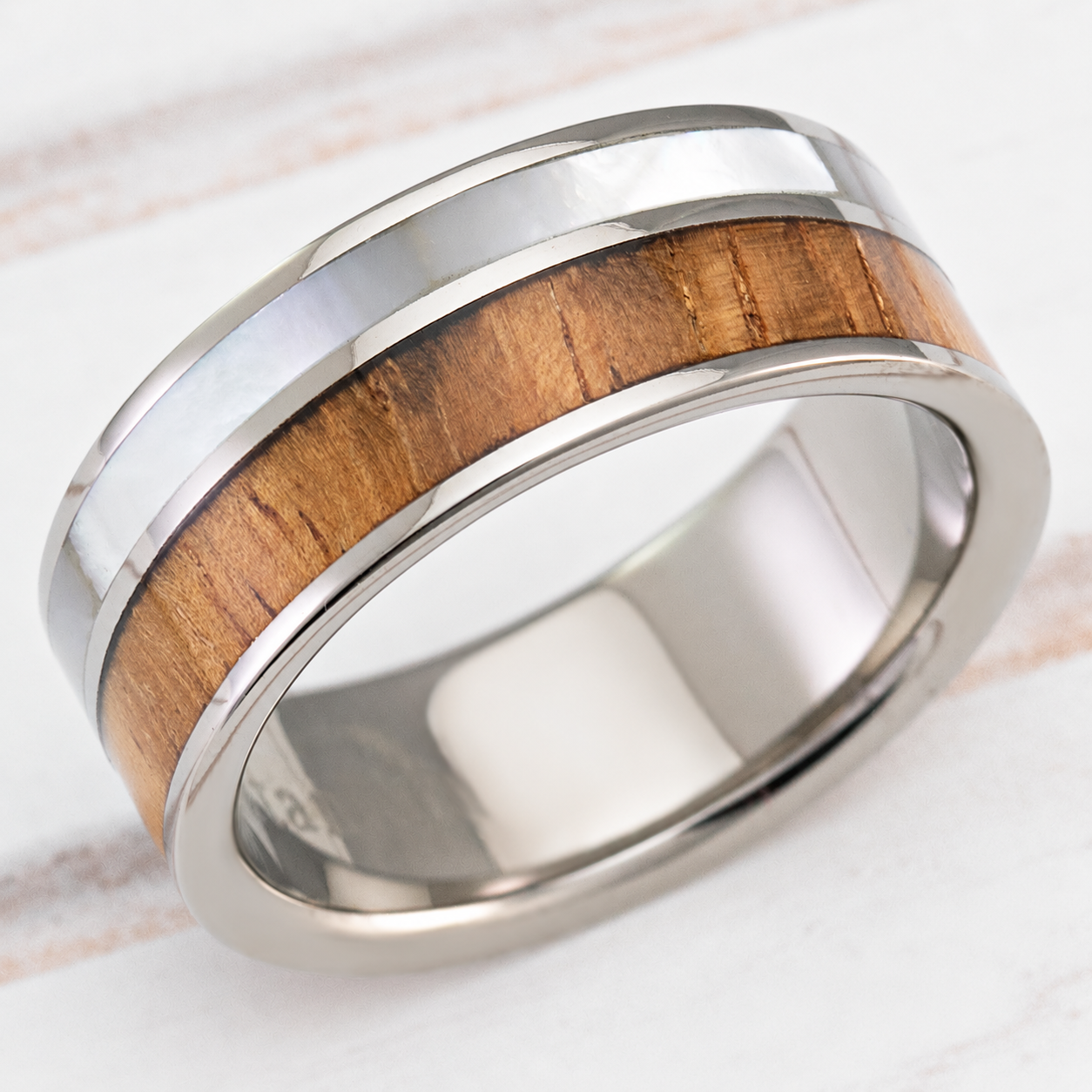 Titanium ring with Hawaiian koa wood and mother-of-pearl inlays