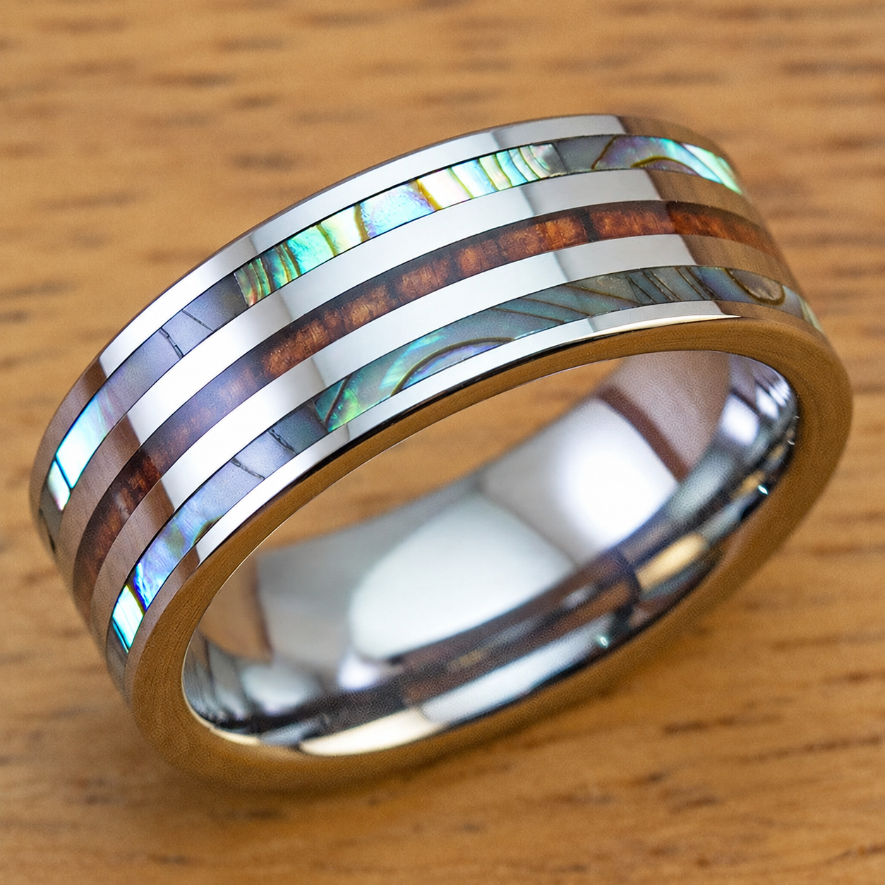 8mm tungsten ring with Hawaiian koa wood and abalone shell tri-inlay, clean product image