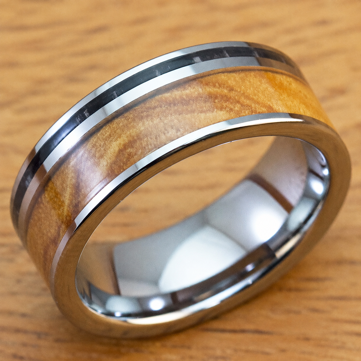 Tungsten carbide ring with olive and ebony wood inlay